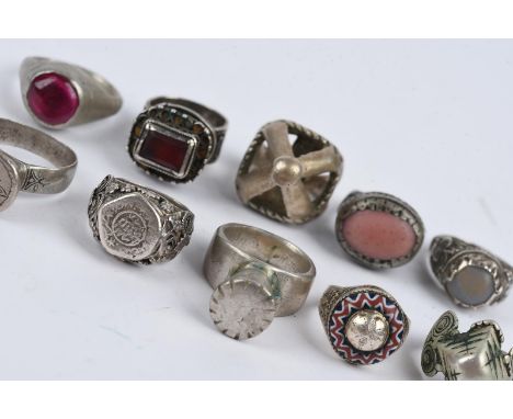 Ten rings Africa and Yemen silver coloured metal, including five with glass beads, one of chevron type and another Moroccan w