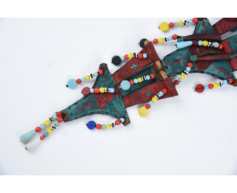 Thirteen Tuareg leather necklace amulets with shells and coins, brass, aluminium and glass beads, the widest 13cm. (13) Prove