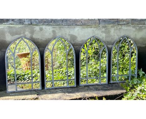 ARCHITECTURAL GARDEN MIRRORS, a set of four, arched metal frames, 60cm H x 38cm W. (4) 