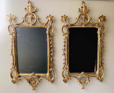 WALL MIRRORS,  a pair, Chippendale style with gilt metal frames, 118cm H x 61cm W. (2) 