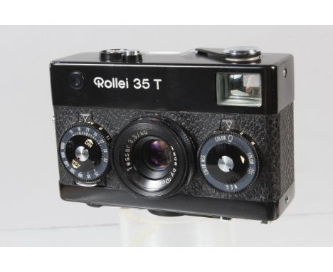 A Rollei 35 T Compact Camera, black, shutter working, meter responsive, body G, paint scratch to top corner, with Rollei 40mm