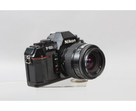 A Nikon F-501 SLR Camera, powers up, shutter wotking, meter responsive, self timer working, body G-VG, with AF Nikkor 35-70mm