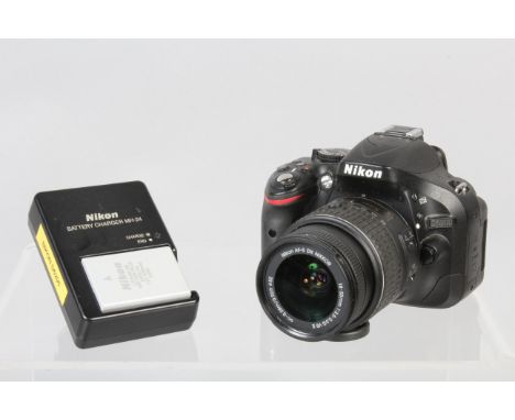 A Nikon D5200 DSLR Camera, powers up, shutter working, flash working, appears to function as should, body G, light wear, with