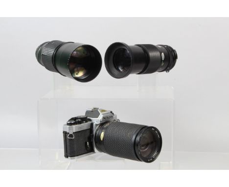 A Nikon FM2n  SLR Camera, chrome, serial no 7627072, shutter working, meter responsive, self timer working, body F-G, ding to