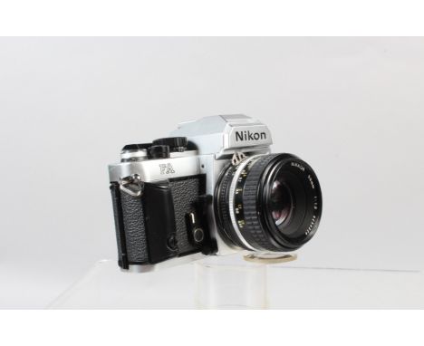 A Nikon FA SLR Camera, chrome, shutter working, meter responsive, self timer working, body G-VG, with Nikkor 50mm f/1.8 Ai-S 
