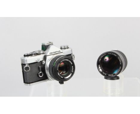 An Olympus OM-1n MD SLR Camera, shutter working, meter responsive, self timer working, body G, light wear, with a Zuiko 50mm 