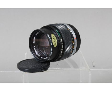 An Olympus OM Zuiko 100mm f/2.8 Lens, barrel G-VG, light wear, elements G-VG, with rear and unbranded front cap 