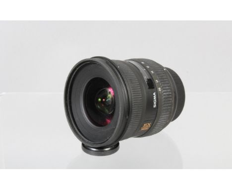 A Sigma EX 10-20mm f/4-5.6 DC USM Lens, Nikon AF mount, auto focus functions, barrel G, light wear, elements G-VG, with front
