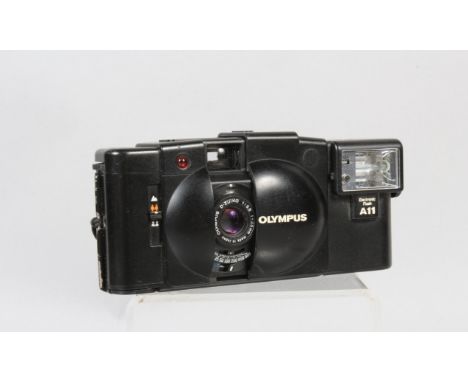 An Olympus XA 2 Compact Camera, shutter working, self timer working, body G, some paint scratches to edges of film door, elem