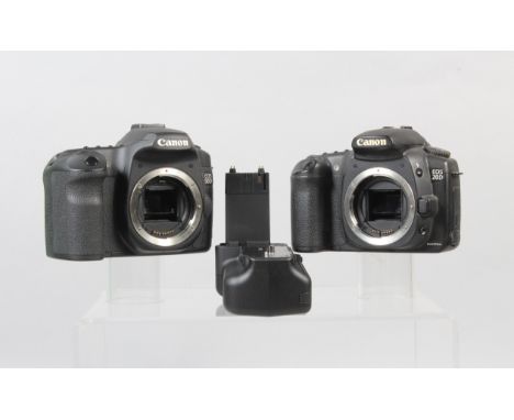 Two Canon DSLR Camera Bodies,  a Canon EOS 20D, powers up, shutter working, flash working, appears to function as should, bod