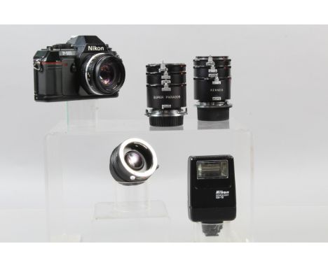 A Nikon F-301 SLR Camera, powers up, shutter working, meter responsive, self timer working, body G=-VG, with Nikkor 50mm f/1.