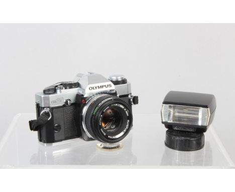 An Olympus OM20 SLR Camera, shutter working, meter responsive, body G-VG, with Zuiko 50mm f/1.8 lens, barrel G-VG, elements G