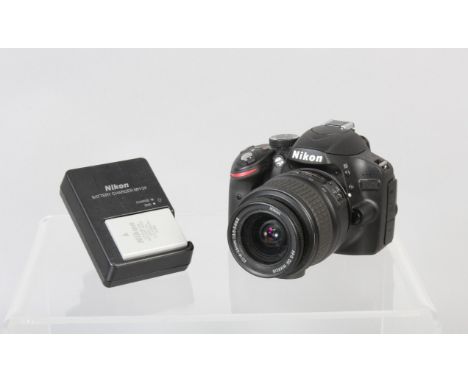 A Nikon D32OO DSLR Camera, powers up, shutter working, flash working, appears to function as should, body G, light wear, with