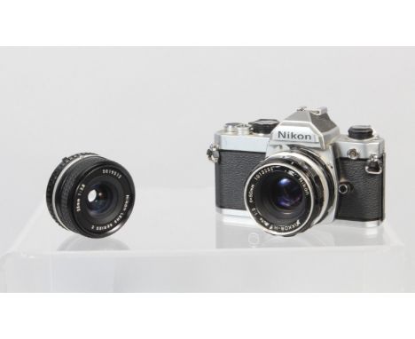 A Nikon FM SLR Camera, shutter working, meter unresponsive, body G, some brassing, some wear, with Nikkor H 50mm f/2 non AI l