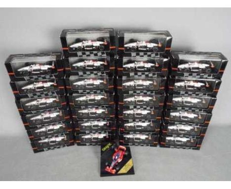 Onyx - A collection of 27 boxed 1:43 scale diecast mainly 'Indy Cars' by Onyx. Models appear to be in Mint condition in Very 