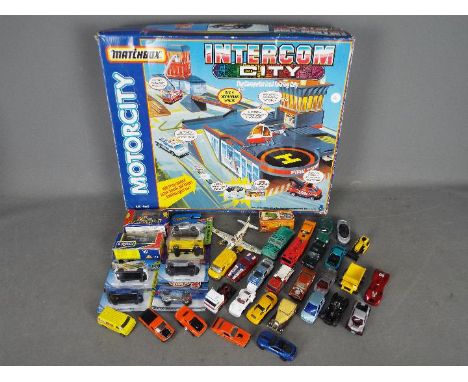 Matchbox, Hot Wheels Corgi, Dinky Toys  - A boxed Matchbox Motorcity MC-560 Intercom City which is in Playworn condition in a