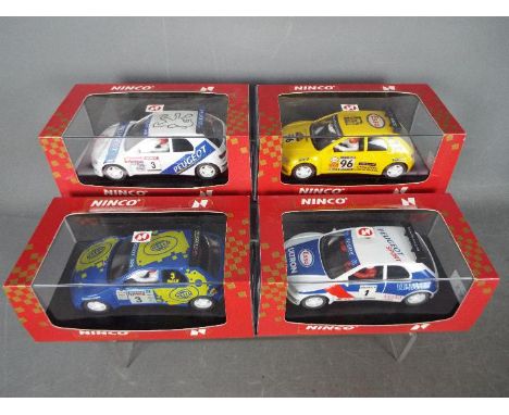 Ninco - 4 x Peugeot 306 Rally cars in including # 50135 in Hella livery, # 50122 in Peugeot livery, # 50121 in Esso livery. #