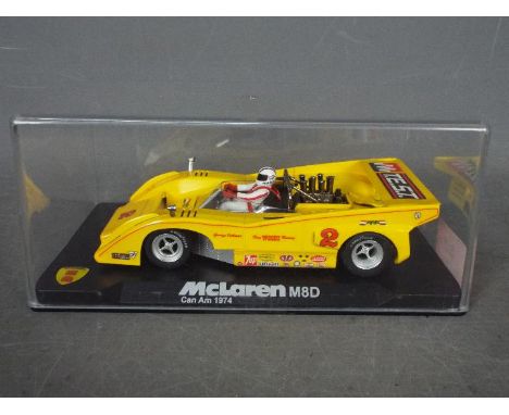 Vanquish Miniaturas - McLaren M8D 1974 Can Am car # CA7. The model appears Mint in a Very Good perspex display case with only