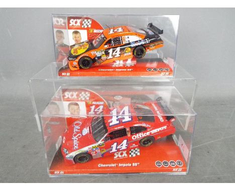 SCX - 2 x Chevrolet Impala SS slot cars, # 64410 in Old Spice livery and the other car in Bass Pro Shops livery which is in t