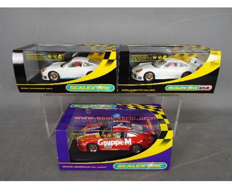 Scalextric - 3 x Porsche 911 GT3R models. # C2629 in plain white, # C2629 with Schmidbauer Modellauto decals, # C2664 in Grup