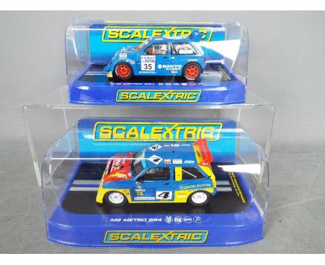 Scalextric - 2 x MG Metro 6R4 rally cars # C3494 Lawrence Gibson car and # C3639 Willie Rutherford car. Both models appear Mi