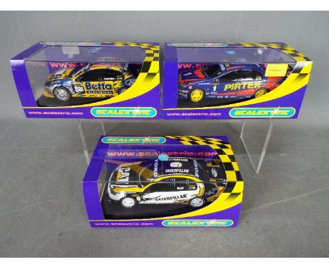 Scalextric - 3 x Ford BA Falcon race cars. # C2694 in Pirtek livery, # C2695 in Caterpillar livery, # C2693 in Betta Electric