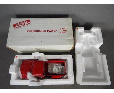 Danbury Mint - 1956 Ford F-100 Pickup Truck in 1:24 scale. The model appears Mint if a little dusty from display and would be