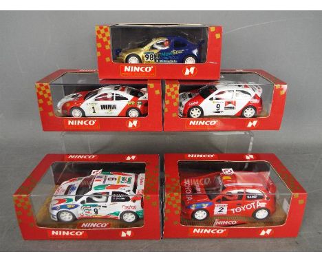 Ninco - 4 x Toyota and 1 x Renault rally cars including # 50161 Megane Catalunya Rally, # 50152 Toyota Celica, # 50176 Coroll