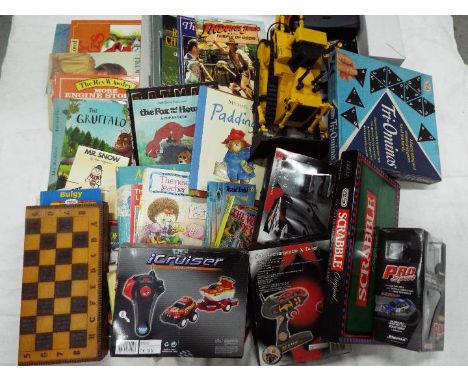 Nikko, Ripmax, Ideal, Others - A mixed lot containing a quantity of boxed RC vehicles with a small collection of vintage game