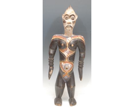 Tribal Art - an Idoma figure, depicted standing, decorated in polychrome with bold geometric motifs, 53cm high, Nigeria