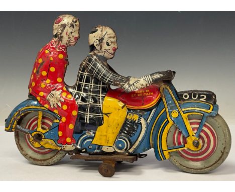 A Mettoy tinplate clockwork toy, as two clowns riding a motorcycle, registration number OU2, 21.5cm long, mid-20th century