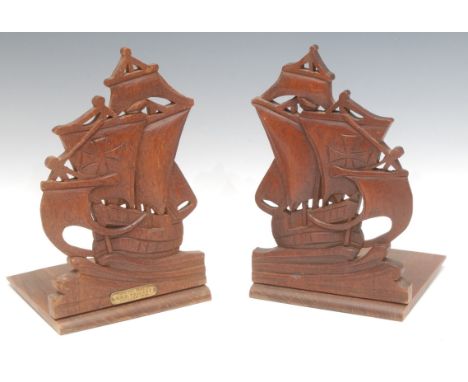 Maritime Salvage - a pair of early 20th century novelty folding book ends, carved as ships, brass label, From the Teak of HMS