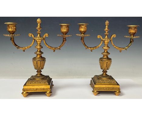 A pair of French Louis XVI Revival ormolu two-light candelabra, cast throughout in the neoclassical taste, 26.5cm high, c.190