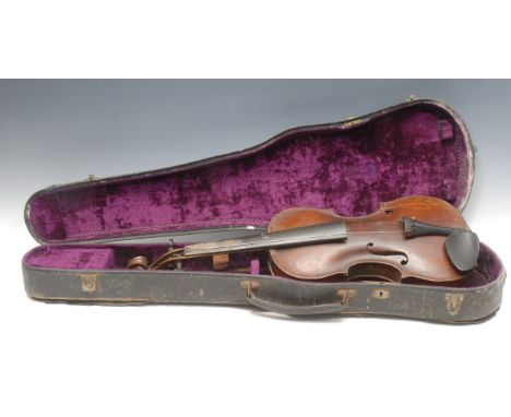 A violin, the one piece back 35.5cm long excluding button, paper label printed Johann George Lippold, Musical Instrumentenmac