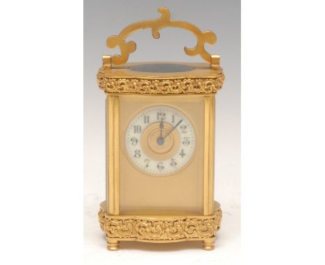 A 19th century French carriage clock, scroll handle above gilt serpentine frieze, white enamel dial with Arabic numerals, bev