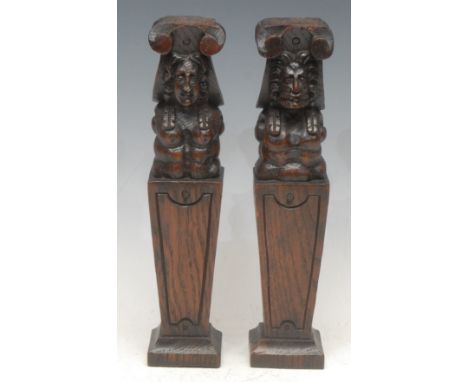 A pair of Renaissance Revival oak carvings, as male and female architectural herms, 28cm high, 19th century
