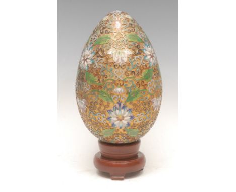 A 19th/early 20th century Chinese cloisonné enamel desk ornament, as an egg, decorated throughout with Ruyi and lotus flowers