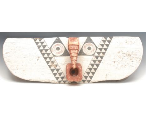 Tribal Art - a Bobo/Bwa hawk plank mask, highly stylised features decorated in tones of red, black and white, 94cm wide, Burk