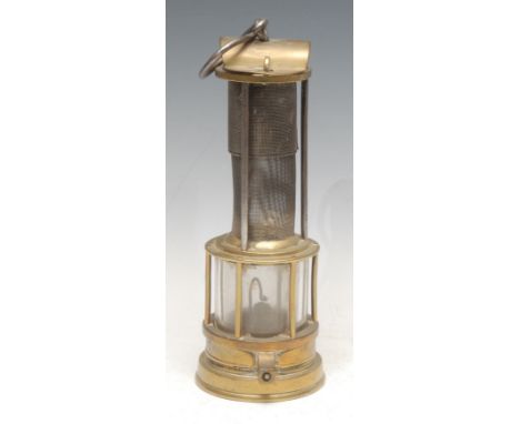 A 19th century Davy type brass miner's lamp, inscribed J Mills, Newcastle, arched top, protecting gauze within three columns,