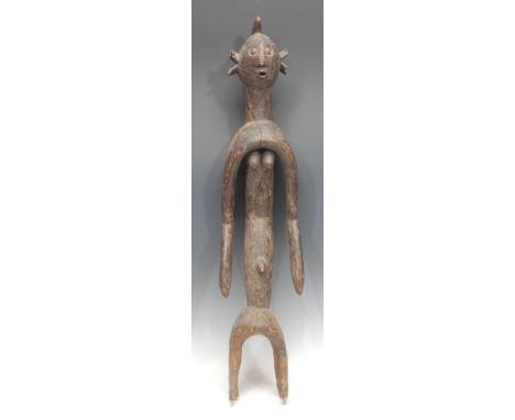 Tribal Art - a Mumuye figure, of typical elongated form, ovoid head with stylised abstract features, concave midriff, 83cm hi