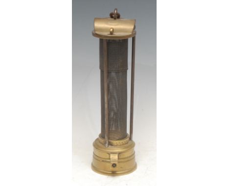 A 19th century Davy type brass miner's lamp, inscribed J Mills, Newcastle, arched top, protecting gauze within three columns,