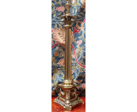 Early 20th century brass column form table lamp on claw support. App. 72cm H Used condition, not tested for working