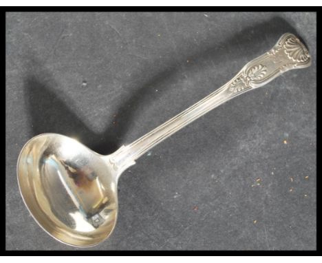 A 19th century Georgian silver hallmarked ladle in the Kings pattern having detached shell to the verso of the bowl. Hallmark