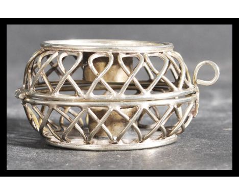 A hallmarked Israel silver campaign folding tea light holder with pictorial of a building to both sides with text above. Stam
