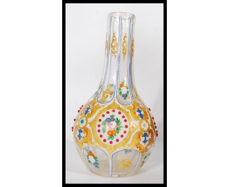 A 19th century Czech Bohemian in the manner of Moser glass vase of baluster form, with enamel and hand applied detail flowers