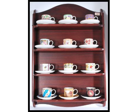 A collection of twelve Coalport ' Historic Coffee Cup Collection ' cabinet cups and saucers, each a limited edition of 15,000