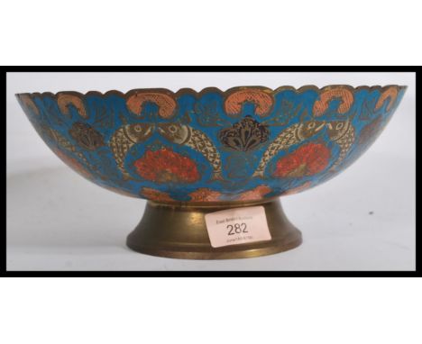 An early 20th century Chinese Cloisonne enamel centerpiece pedestal bowl having a scalloped rim with deep blue enamel ground 