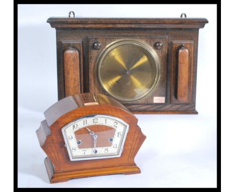 A 1920's oak wall barometer with circular dial set on oak square backing together with a 1930's Art Deco walnut mantel clock 