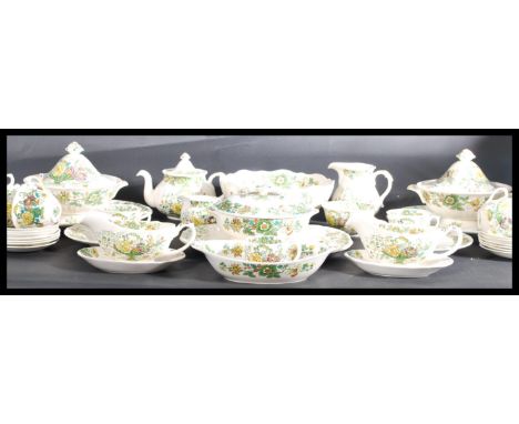An early 20th century Mason Masons ceramic dinner and tea service in the green Strathmore pattern consisting of three lidded 