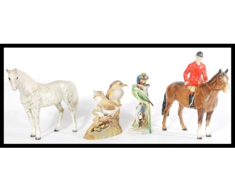 A collection of 20th Century ceramic figures to include Beswick horses, a Crown Derby Thrush and a Royal Adderley figure grou